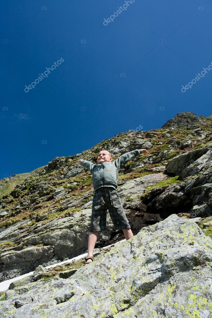 Boy Climbing Mountain