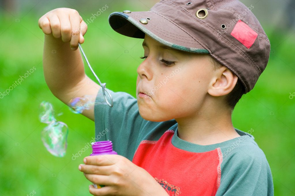 boy blow bubbles