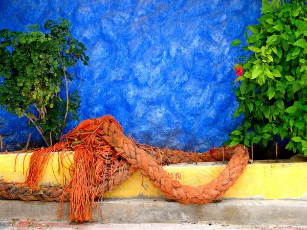 Orange rope and blue wall