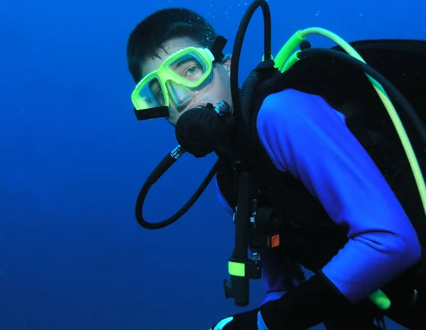 Young boy scuba diver in full gear