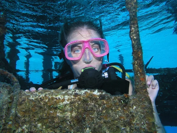 Woman diver on a shipwreck dive site