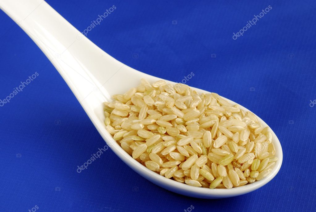 A Spoonful Of Uncooked Brown Rice Stock Photo Johnkwan 2303591 a-spoonful-of-uncooked-brown-rice-stock-photo-johnkwan-2303591