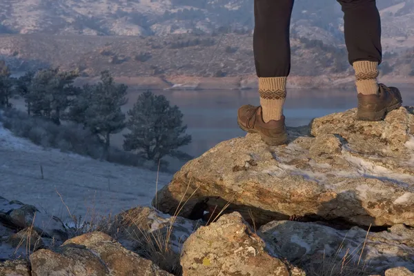 Hiker or trail runner legs on rock