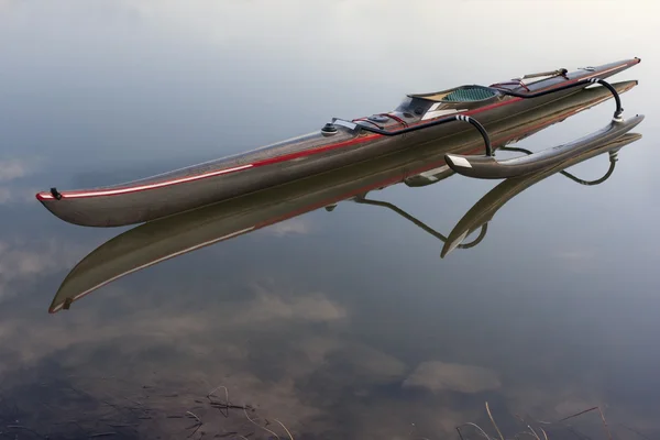 Long and slim racing outrigger canoe