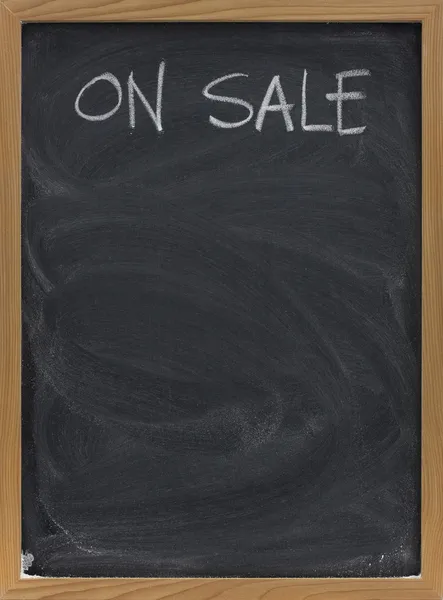 Sale advertisement on blackboard in vertical