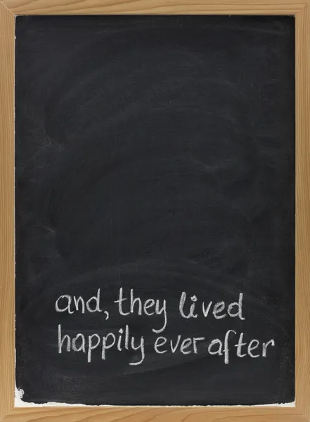 Fairytale happy end phrase on blackboard