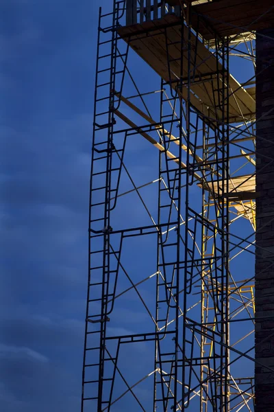 Construction scaffolding, nighttime