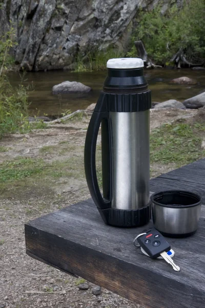 Stop and rest when driving - car key, thermos bo
