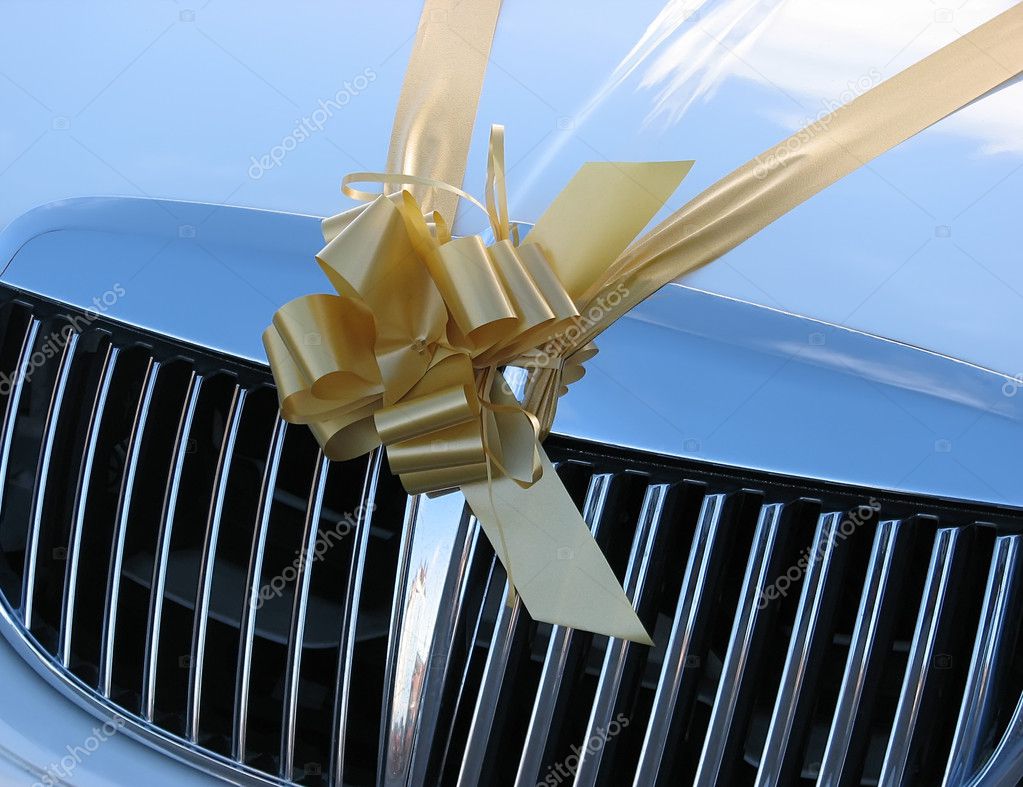on hood of wedding car