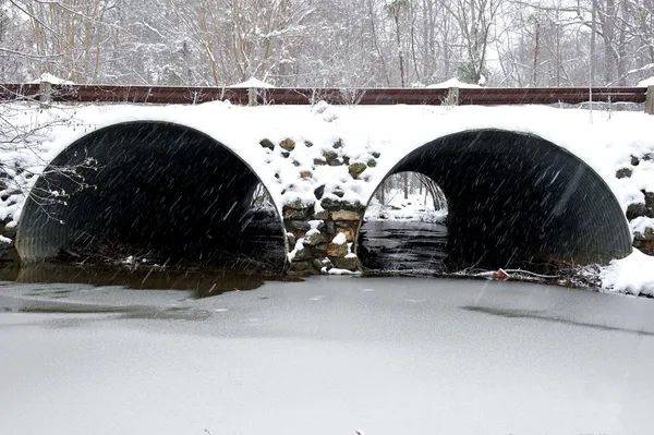 Snow covered drainage tunnel.