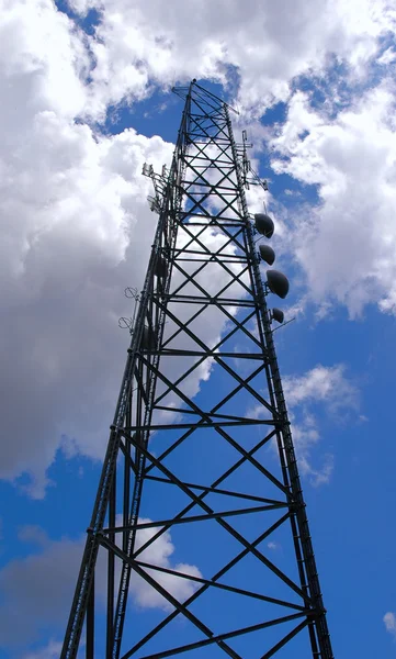 Cellular tower reaching the clouds