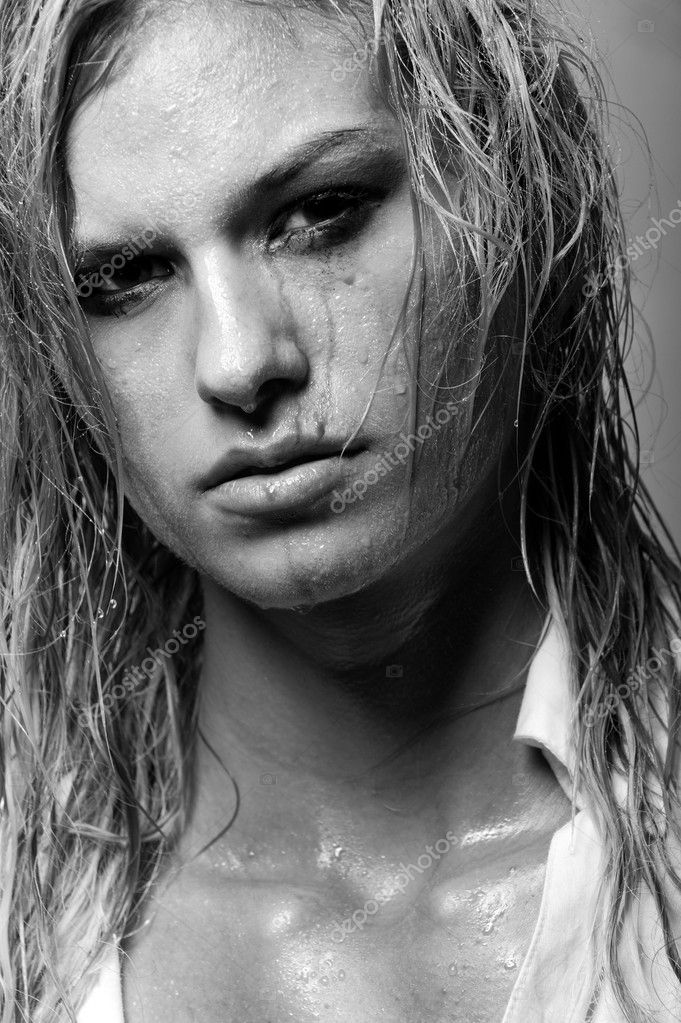 Blonde girl with wet hair and running mascara