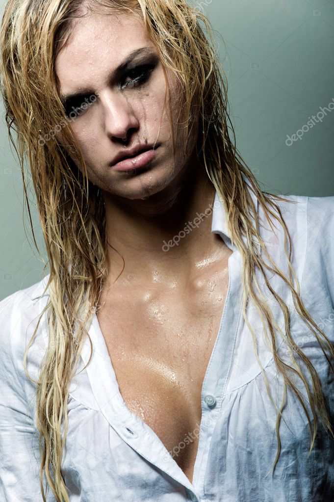 Blonde girl with wet hair and running mascara