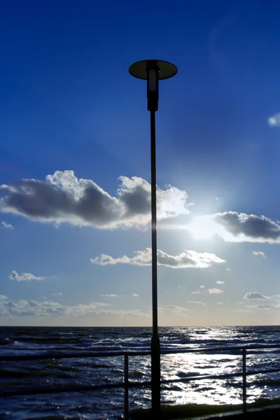 Lonely lamp on a blue sky
