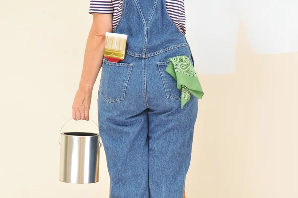Woman in Overalls Painting