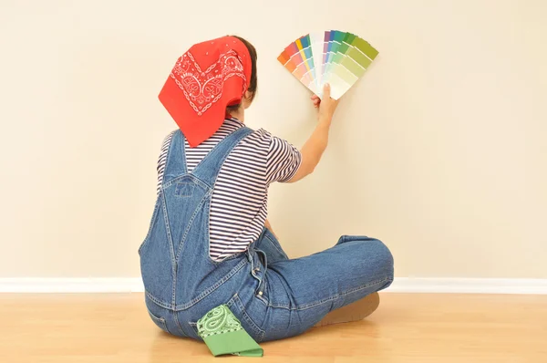Woman in Overalls with Paint Samples