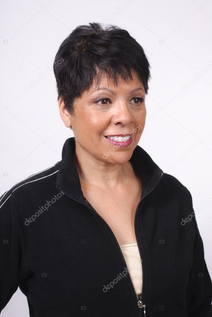 Mature woman with short hair in black jacket