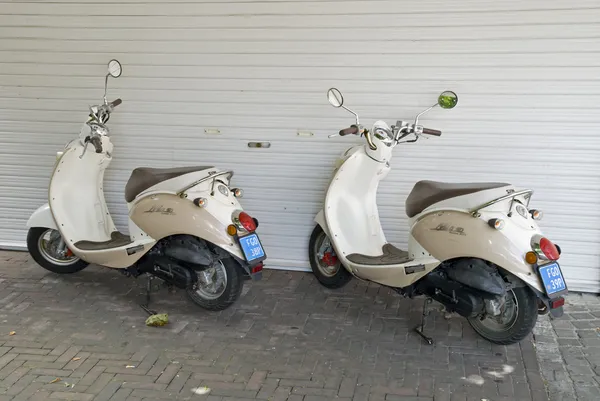 Two parked scooters