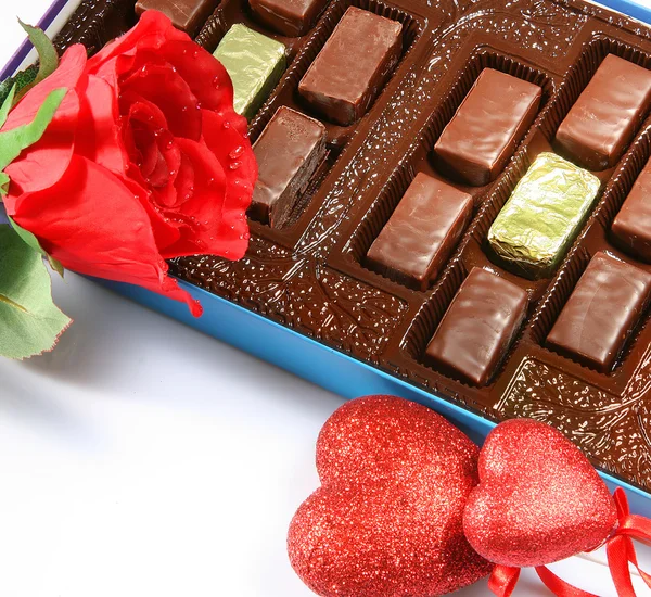 Box of chocolates, rose and heart