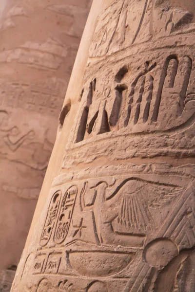 Ancient hieroglyphics on stone column