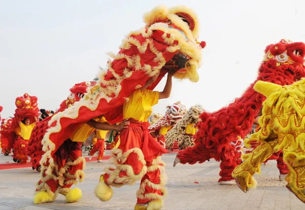 Chinese people playing lion dance celebrating the coming new year.
