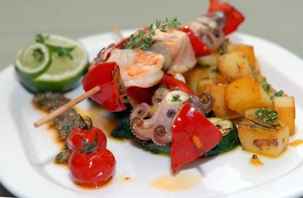 Shish kebabs from seafood and vegetables