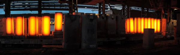 Piles of hot iron blocks in foundry.