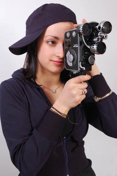 Young girl with old film (movie) camera