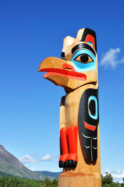 Eagle Totem Pole Against a Blue Sky