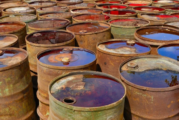 Old rusty toxic barrels