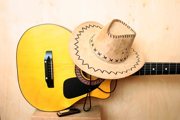 Classical guitar, hat and harmonica