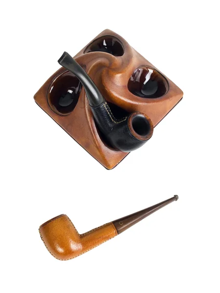 Leather pipes in pipe stand