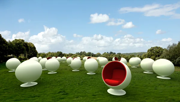 Cocoon chairs in a meadow