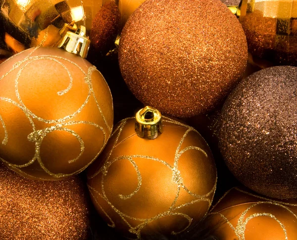 Gold Christmas Baubles in feather nest