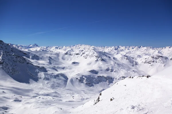 Panoramic view on Alps winter mountains
