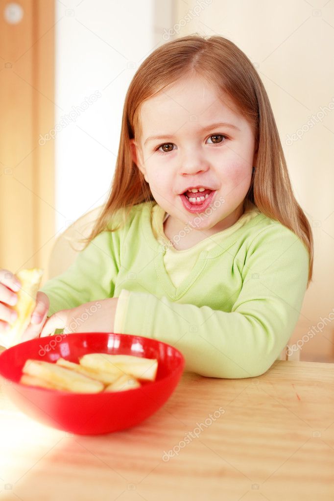 Beautiful small girl eating