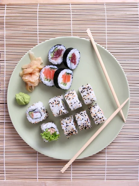 Sushi rolls, ginger and chopsticks