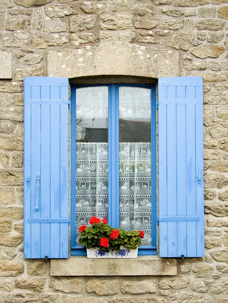 French window with blue shutters