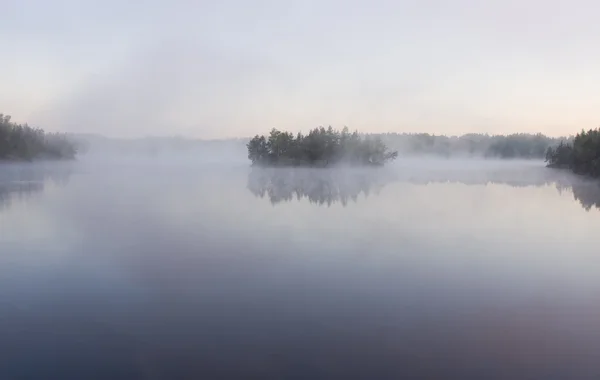 Island in morning fog