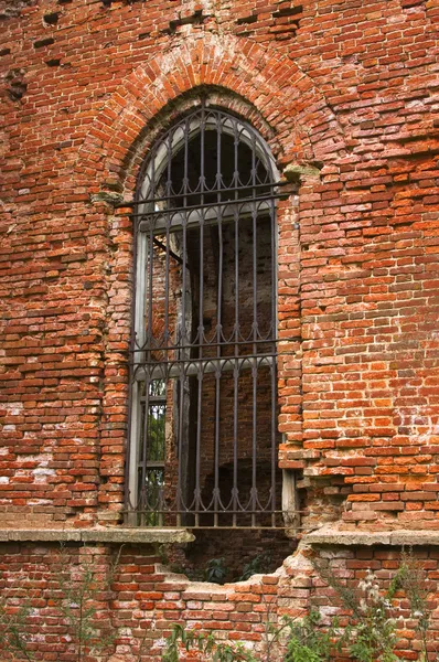 Ancient brick wall with window