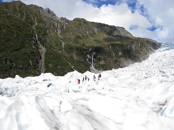 Tourists hiking on Fox Glacier, NZ