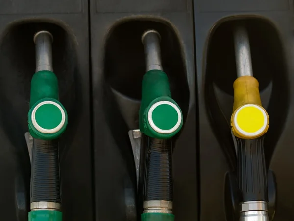 Green and yellow gas pump rack