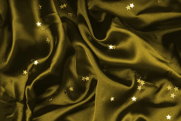 Dark olive textile with golden stars
