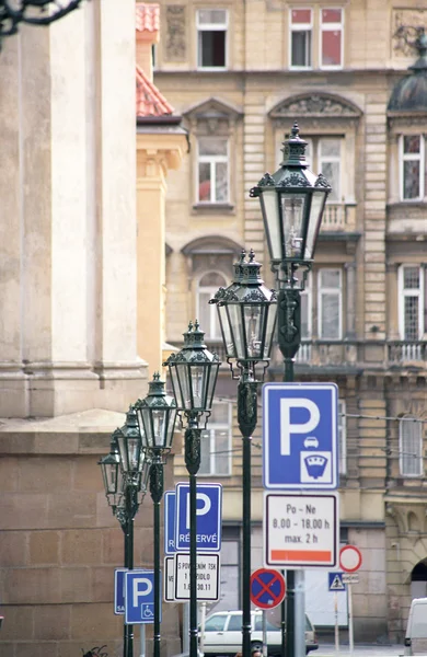 Street lamps and traffic signs. Prague.