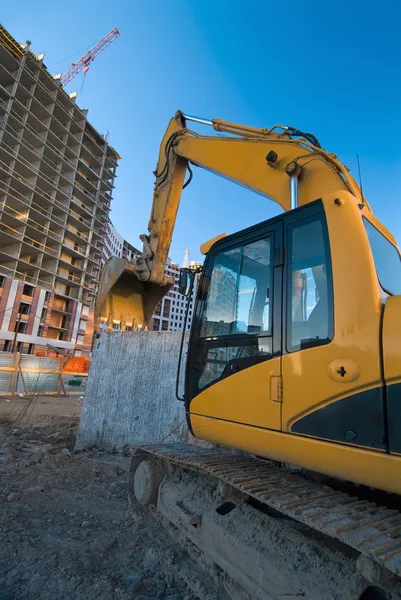 Excavator at the construction place — Stock Photo #2406415