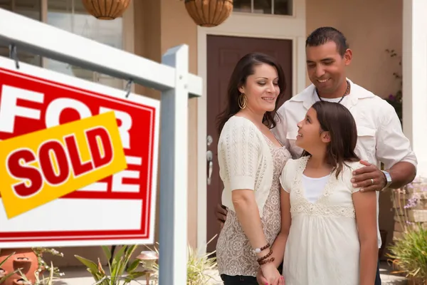 Hispanic Family and Real Estate Sign