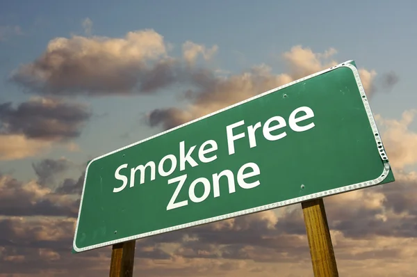 Smoke Free Zone Green Road Sign In Front