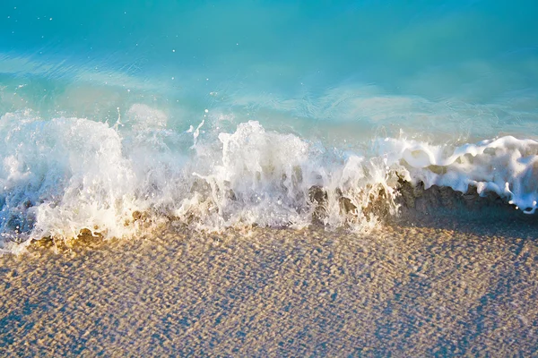 Sea waves ending in the sand