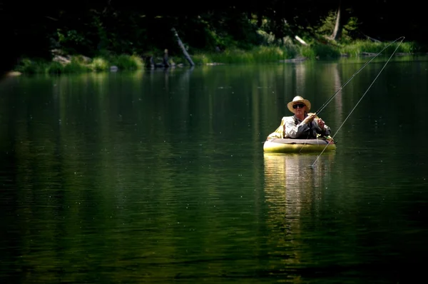 Man Fishing in Lake