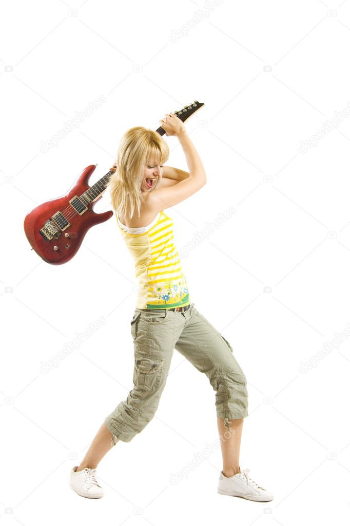 Woman guitarist trying to break her electric guitar